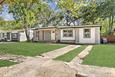 Ranch-style home with a front lawn