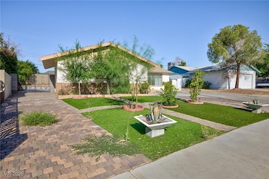 View of front facade featuring a gate and stucco s