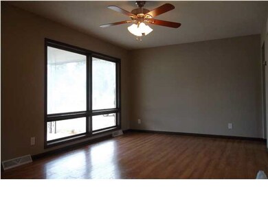 New flooring & fan. Large windows let in lots of l