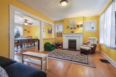 Fresh paint tones and the exposed HW floors give t