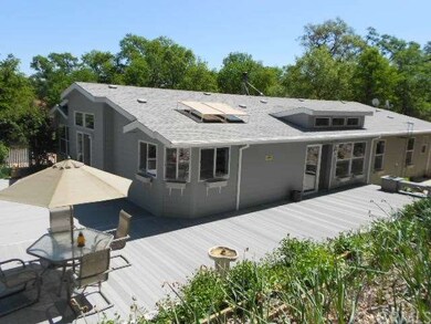 View of back of home from terraced flower beds