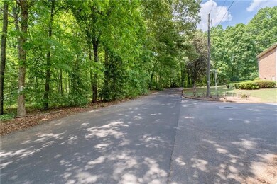 View up to end of Oakmont Rd with Oakmont lot at end and Erskine Lot to Left