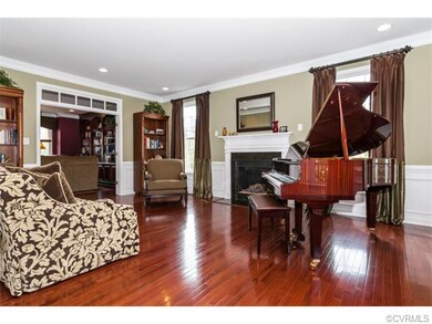 Living Room shows off gorgeous hardwoods and gas f