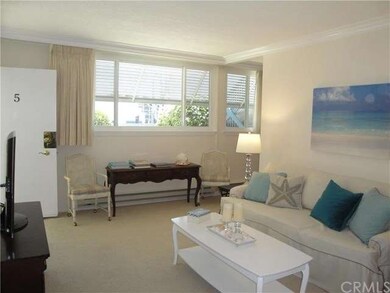 Living room to front entrance and picture windows 