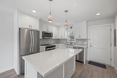Gorgeous modern kitchen featuring quartz counterto