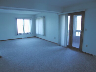 Living Room w/Door to Covered Balcony