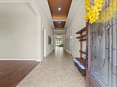Wide entry with high ceilings allowing plenty of space for guest, casual visitors and decorative furnishings.