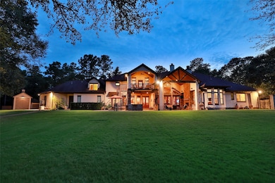 Rear exterior view at night featuring 75 Landscape and Security Lights throughout the property.