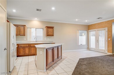 Kitchen featuring light tile patterned flooring, l