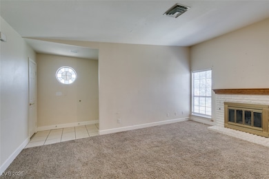 Unfurnished living room with light colored carpet,