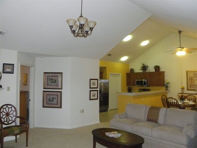 Another view of living room into kitchen