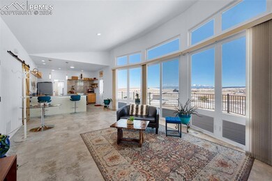 Living room featuring high vaulted ceiling and ama