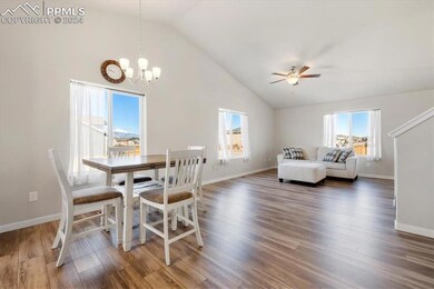 Dining area featuring ceiling fan with notable cha
