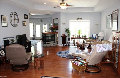 Gleaming hardwood and open concept style! Lovely t