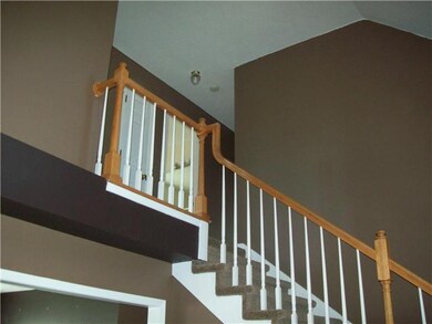 Open stair rail adds architectural design to this open living space. 