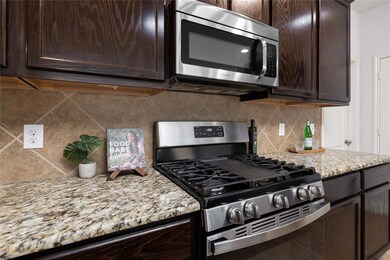 Kitchen featuring appliances with stainless steel