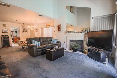 Living room features 16' vaulted ceiliing, firepla