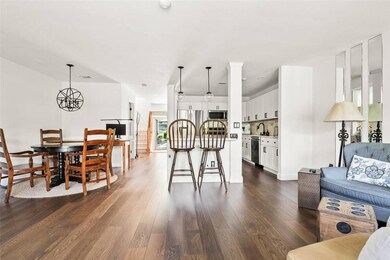 Dining space with dark wood finished floors