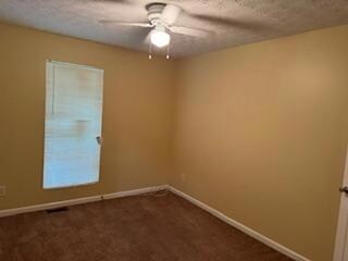 Spare room with ceiling fan