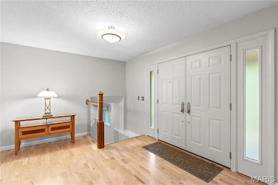 Foyer featuring light wood finished floors