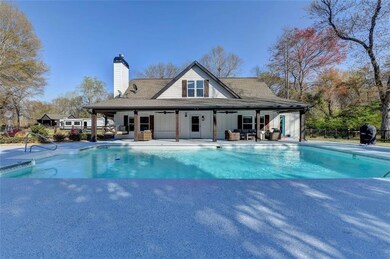 View of pool featuring a fenced in pool, a patio, 