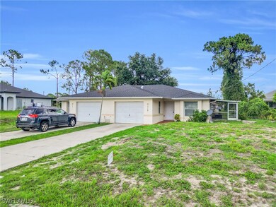 View of front of home featuring a garage, stucco s