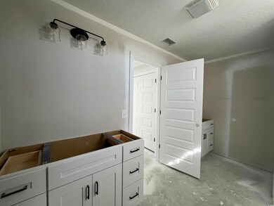 Bathroom featuring concrete flooring and a texture