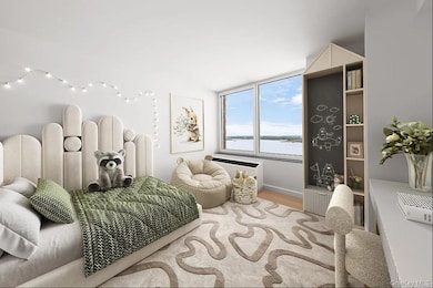 Bedroom featuring wood finished floors and a water view