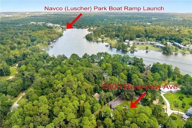 Drone / aerial view of a forest and a large body of water