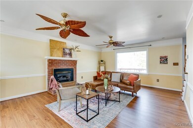 Living Room with new LVP flooring, gas fireplace a