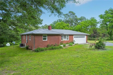 View of side of property with a chimney, central A