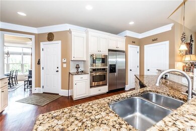 White kitchen with granite countertops