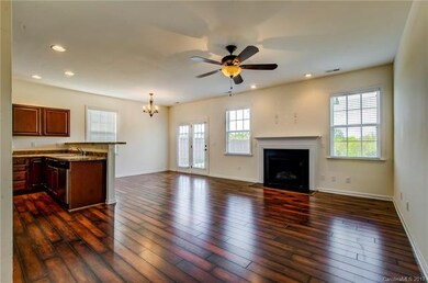Open floor plan in living, dining, kitchen.