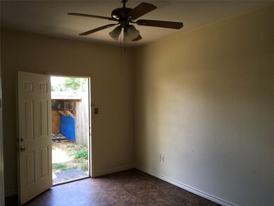 Unfurnished room featuring baseboards and a ceili