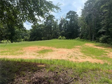 View of yard featuring a wooded view