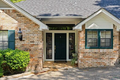 Property entrance featuring brick siding and a shi