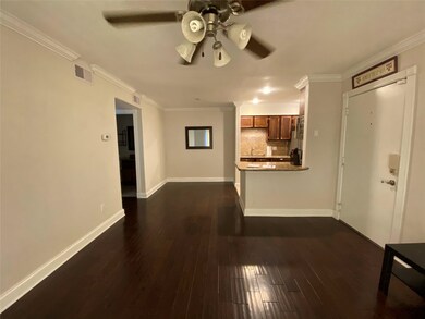 Wood floors in living and dining area.  Crown mold