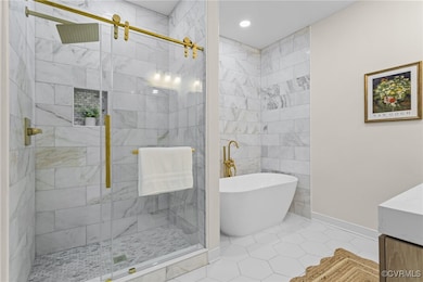 Full bathroom with a freestanding bath, a stall sh