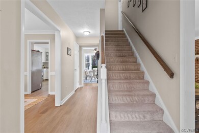 Stairs featuring ornamental molding, ceiling fan,