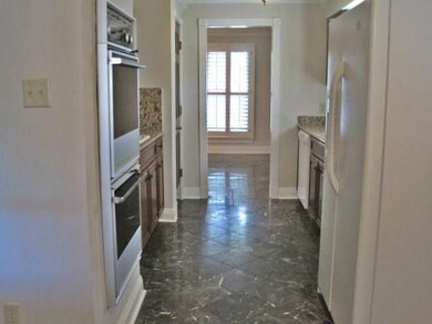 Kitchen w/ view of formal living/dining
