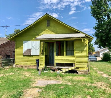 Bungalow-style house with a front lawn