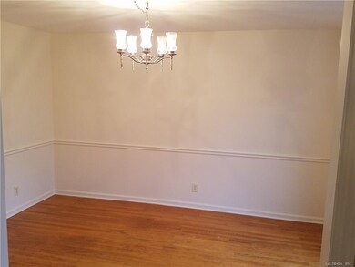 THE DINING ROOM IS 13' X 11' AND OVERLOOKS THE FRO