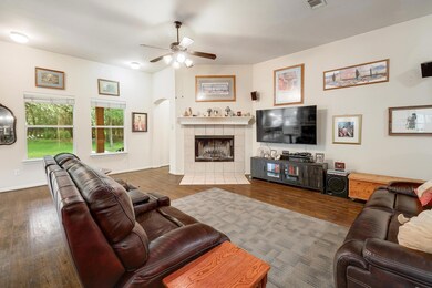 Living room featuring wood finished floors, a cei