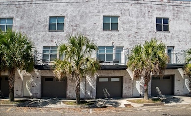 View of building exterior featuring a garage