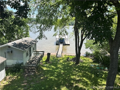 view of backyard overlooking lake