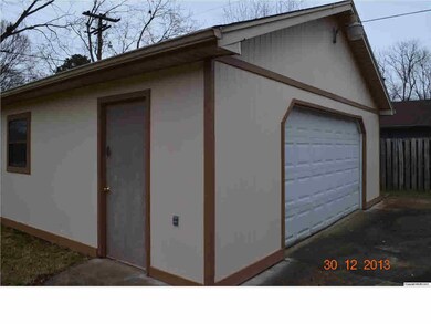 Large detached 2 car garage with Air lines installed for compressor, exhaust fan, and separate electrical box installed.