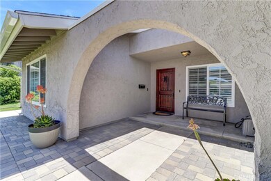 Beautiful entry with pavers and gorgeous front door!