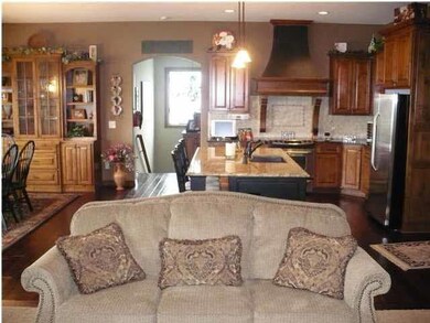 VIEW FROM HEARTH ROOM INTO KITCHEN AND DINING AREA