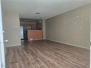 Unfurnished living room with dark wood-type floori