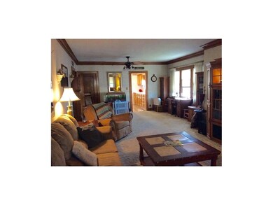 Door at far corner has stairs up to attic that cou